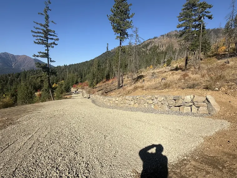 Boulder rockery curving with the new gravel driveway